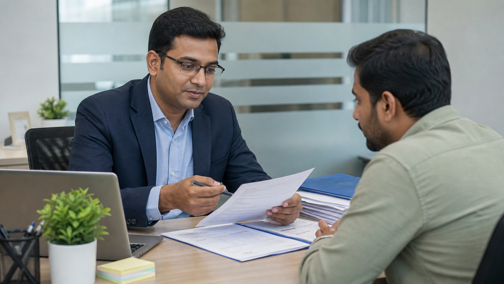 Indian claims advisor helping a client with documentation